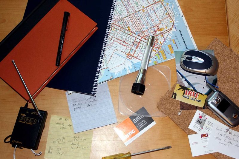 A ledger open beside a laptop showing a running balance